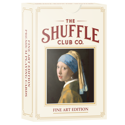 Fine Art Edition playing cards box by Shuffle Club Co. The beige packaging features a reproduction of Vermeer’s 'Girl with a Pearl Earring' painting framed in gold, with the words 'Fine Art Edition' and ornate border details.
