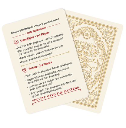 Two Shuffle Club Co. Fine Art Edition cards: one side provides game instructions for Crazy Eights and Rummy in red text with Shuffle With The Masters tagline, while the other shows the deck's ornate gold back design with an intricate pattern.