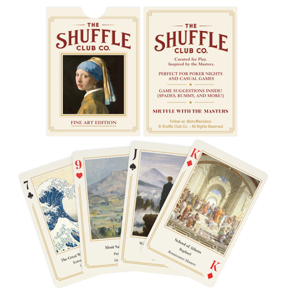 Display of Shuffle Club Co. Fine Art Edition playing cards with two packaging cards (front and back) at the top and a spread of three cards below featuring iconic artworks including The Great Wave off Kanagawa, Mont Saint Michel, and the School of Athens.