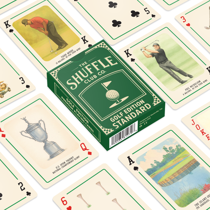 Spread of golf-themed playing cards with the green Shuffle Club Co. 'Golf Edition Standard' box centered among cards featuring golfers, golf trophies, golf clubs, and scenic course illustrations.